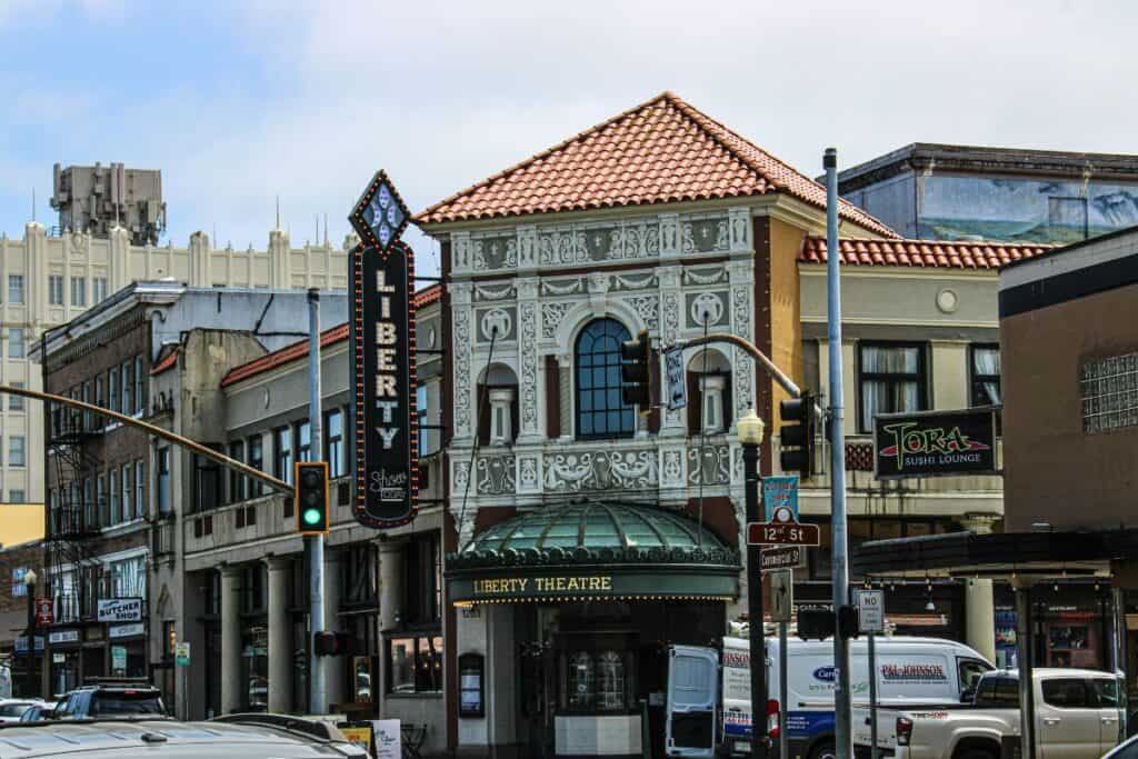 Historic Liberty Theatre in Astoria, Oregon, with vintage architecture and lively downtown atmospher.