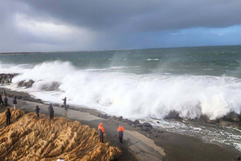 King tides crashing along the Westport Washington jetty with large waves hitting the Washington Coast shoreline