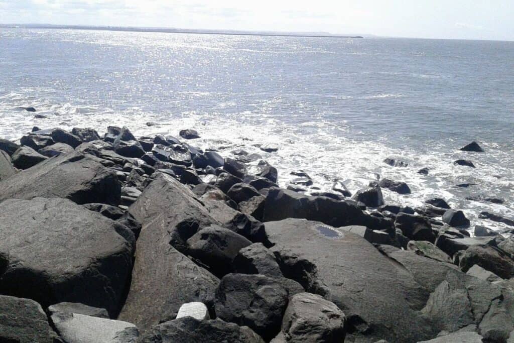 quiet rocky shoreline on the Washington coast near Westport with waves and open ocean views