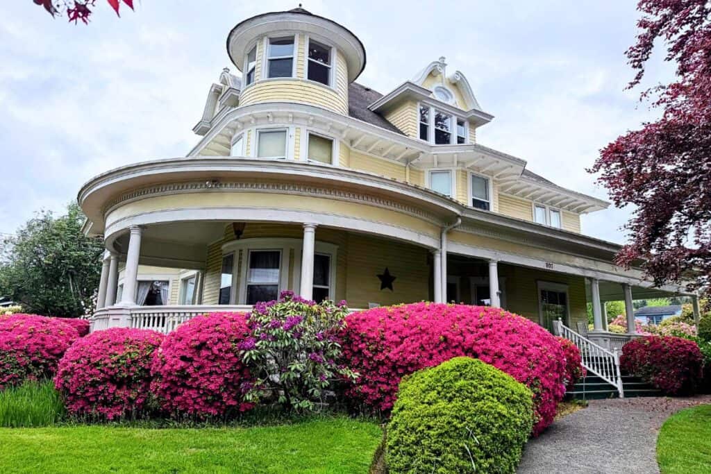 Historic Aberdeen Mansion in Washington Historic Aberdeen Mansion in Aberdeen Washington surrounded by blooming pink rhododendrons.