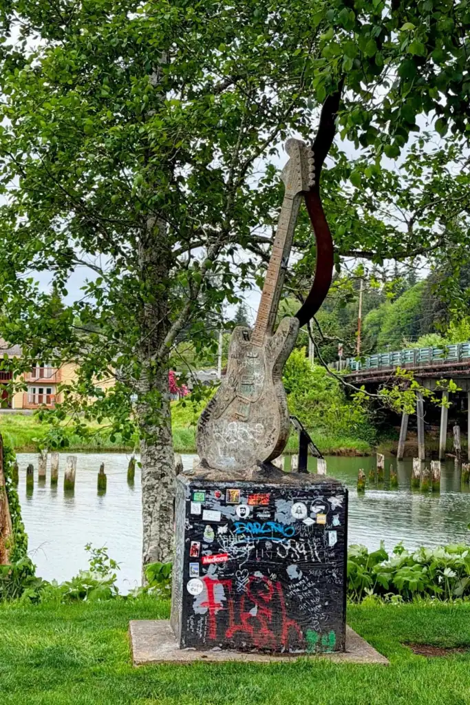 Kurt Cobain Memorial Guitar Sculpture Aberdeen WA 2016 The concrete Kurt Cobain memorial guitar sculpture in Aberdeen Washington heavily covered in colorful fan graffiti and tributes in 2026.