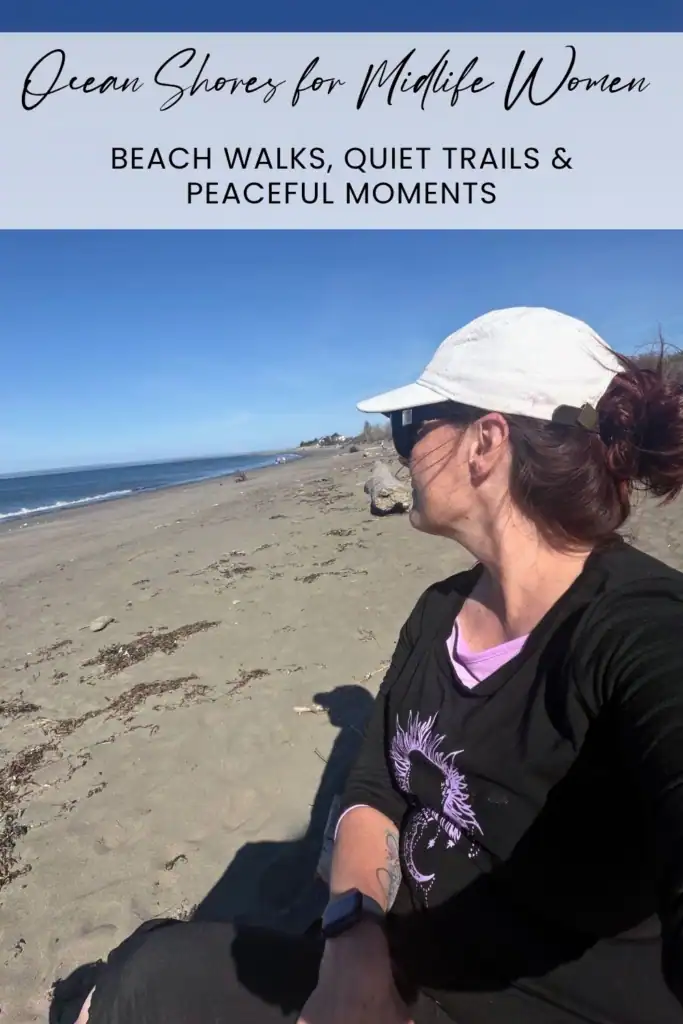 Woman sitting on the beach during a solo coastal getaway in Ocean Shores, Washington