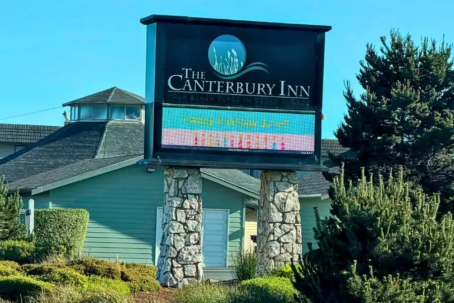 The Canterbury Inn sign and exterior in Ocean Shores, Washington