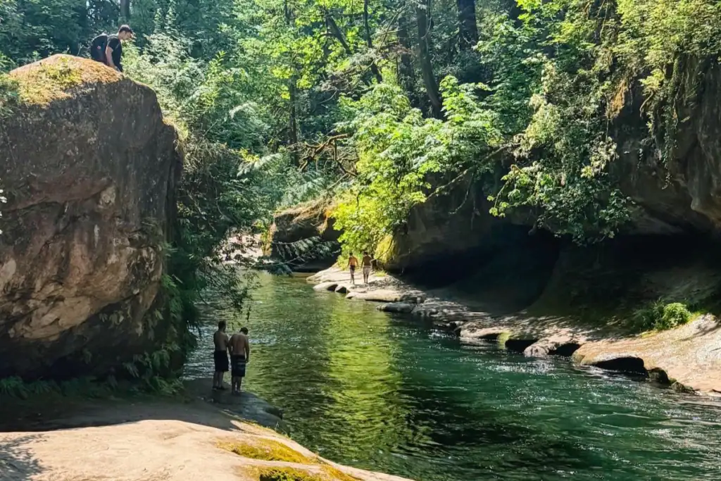Emerald pool at the bottom of Green River Gorge near Enumclaw, Washington Deep green river pool surrounded by sandstone cliffs and forest at the bottom of Green River Gorge