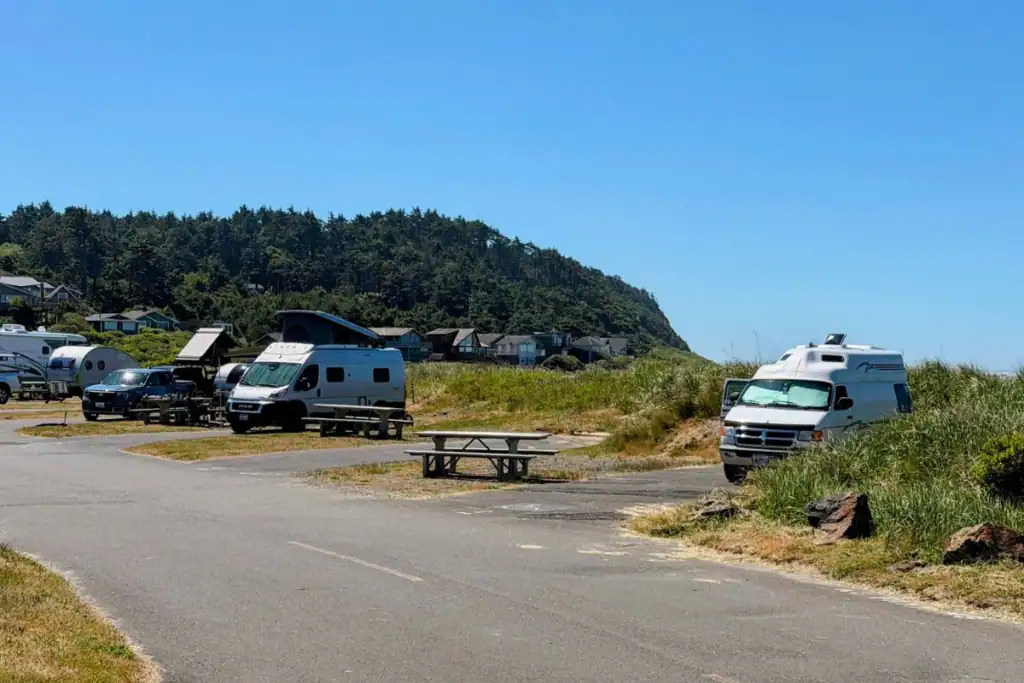 RVs and camper vans parked near the beach at Pacific Beach State Park in Washington